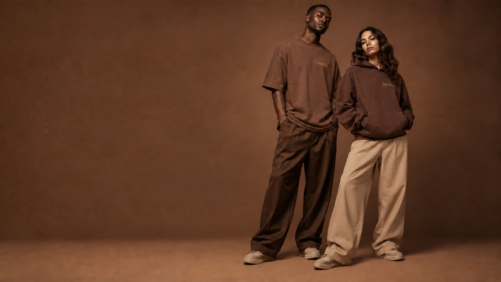 Two models wearing contrasting Cocoa, Sand and Walnut TheMochaLabel garments with the mocha emblem
